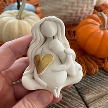 The Divine Nurturer: The Mama Goddess with child and pregnant belly