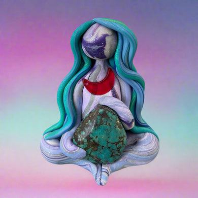 Colorful figurine with long hair and a stone, set against a decorative gold and marble background.